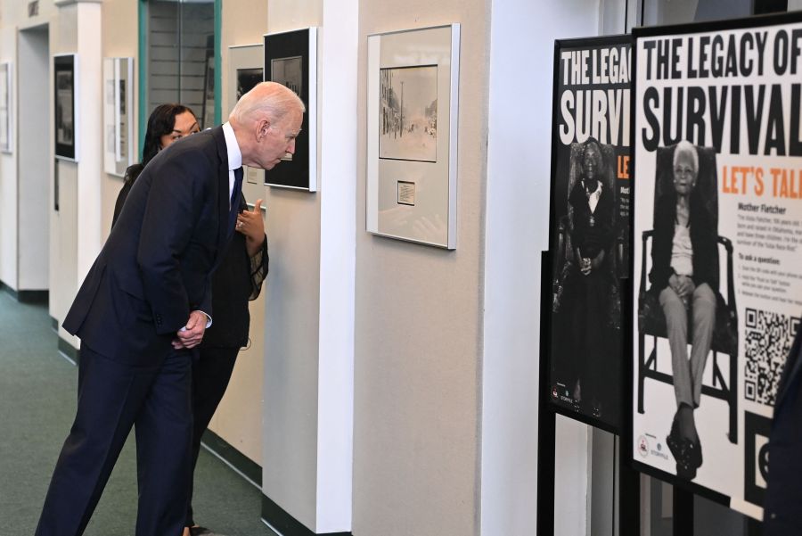 image of US President Joe Biden listens to Michelle Brown-Burdex