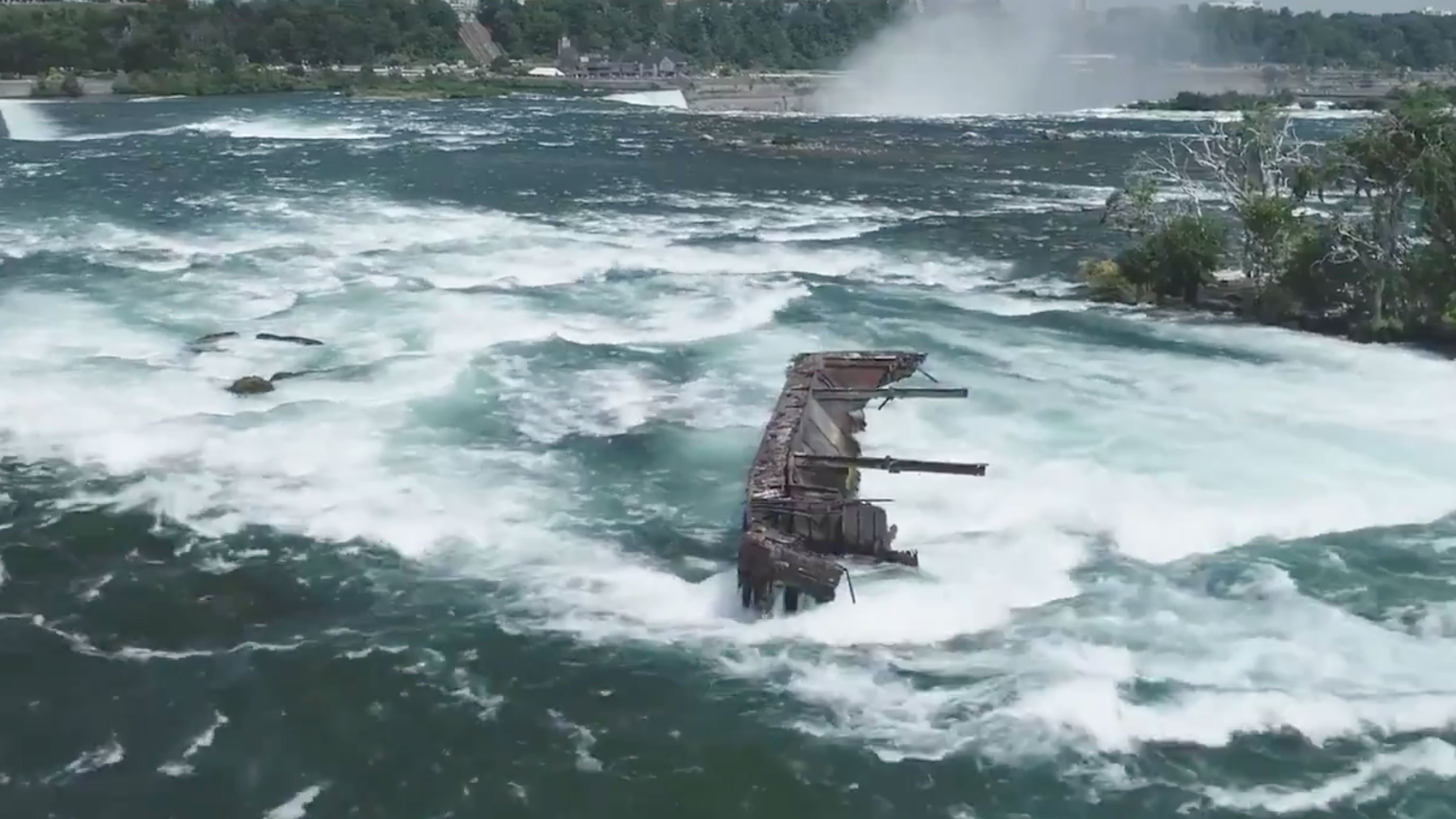 Boat trapped on rocks picture